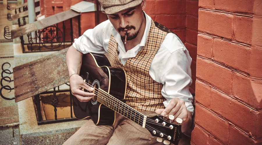 Beginner choosing a guitar in a shop